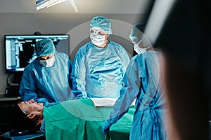 Medical, surgery or doctors in operating room with theater patient or trauma unit for anatomy emergency. Healthcare