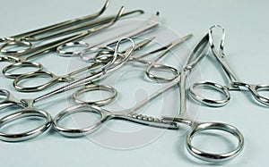 Medical surgical Instruments on blue background. Selective focus