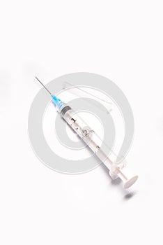 Medical syringe closeup on white background isolated