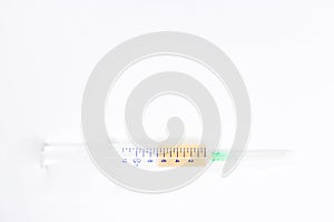 A medical syringe filled with medicine or a drug on a white background.