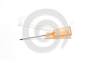 Medical syringe needle isolated on white background.