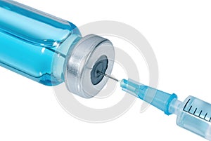 Medical syringe with the needle in the vial with blue vaccine isolated on white background