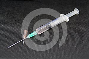 Medical Syringe and spare needle.Testing viruses.