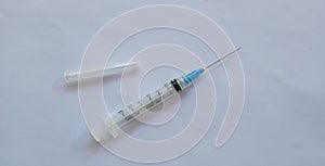 Medical syringe on a white background. A syringe for injection