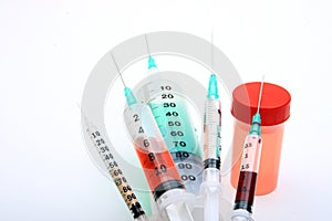Medical syringes and urine vial