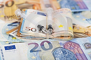 Medical syringes on wad of several euro banknotes bills