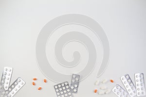 Medical tablets, capsules and pills in blister pack frame as background with copy space for text or image