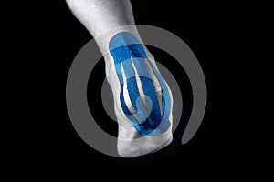 Medical taping for calcaneal pain relief. photo