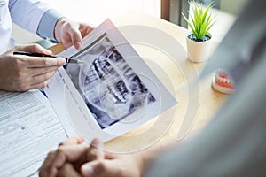 Medical team discussing, health care talking to female patient, Medical conferrence concept, doctor holding and looking at dental