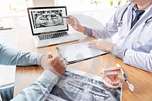 Medical team discussing, health care talking to female patient, Medical conferrence concept, doctor holding and looking at dental