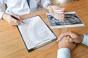 Medical team discussing, health care talking to female patient, Medical conferrence concept, doctor holding and looking at dental