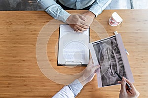 Medical team discussing, health care talking to female patient, Medical conferrence concept, doctor holding and looking at dental