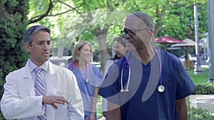 Medical Team Having Discussion Outdoors