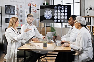 Medical team having meeting in conference room in hospital