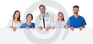 Medical team holding blank billboard