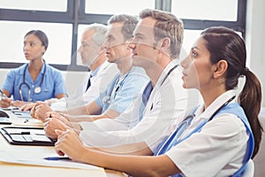 Medical team listening in conference room