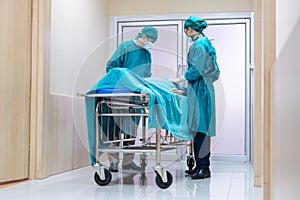 Medical team moving a patient to surgery in the operating room at the hospital