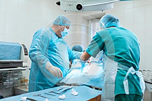Medical team performing operation. Group of surgeon at work