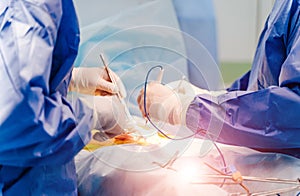Medical team performing surgery in operating room, close up