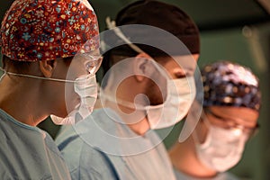 Medical Team Performing Surgical Operation in Modern Operating Room