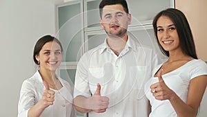 Medical Team Portrait with patient looking on a camera. Slow motion