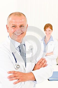 Medical team senior smiling male young woman