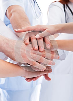 Medical team stacking hands