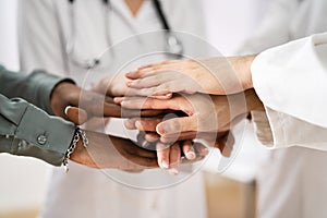 Medical Team Stacking Hands Against