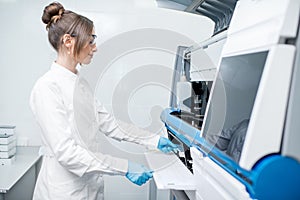 Medical technician working with analyzer