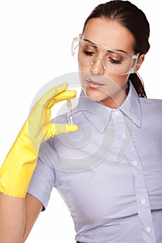 Medical technologist looking at a test tube photo