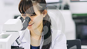 Medical technologist is working in the laboratory. Using a microscope for detect the objects that are too small for the naked eye.