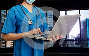 Medical technology concept. Doctor working with mobile phone and stethoscope and digital tablet laptop in modern office at