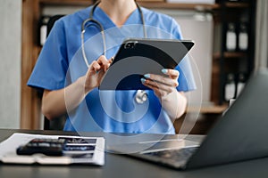 Medical technology concept. Doctor working with mobile phone and stethoscope in modern office