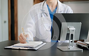 Medical technology concept. Doctor working with mobile phone and stethoscope in modern office