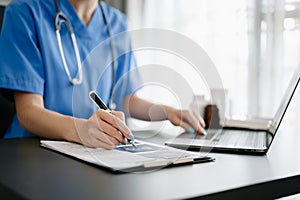 Medical technology concept. Doctor working with mobile phone and stethoscope in modern office