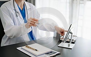 Medical technology concept. Doctor working with mobile phone and stethoscope in modern office