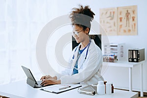 Medical technology concept. Doctor working with mobile phone and stethoscope in modern office.Medical technology concept. African