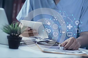 Medical technology concept. Doctor working on modern digital tablet and laptop computer