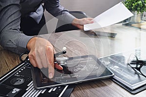 Medical technology concept,smart doctor hand working with modern laptop computer in modern office with virtual icon diagram