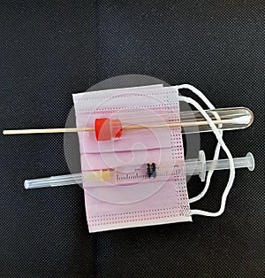 Medical test tools. Tools for medical tests. Syringe, swab and protective mask.