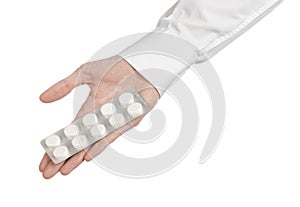 Medical theme: doctor's hand holding a white tablet for health on a white background isolated