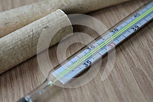 Medical thermometer mercurial with temperature to measure the body temperature photo