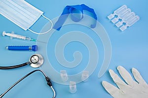 Medical tools and materials on blue background photo
