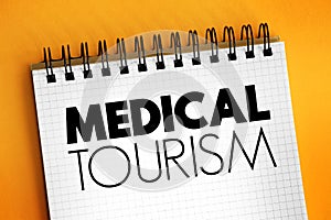 Medical Tourism text on notepad, health concept background