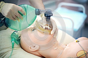 Medical training. Use Ambu bag for lung ventilation using a medical dummy. Medical skills training