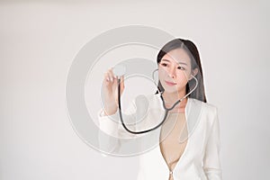 Medical, treatment, doctor, clinical, hospital, diagnosis, health checkup concept. Beautiful asian woman female doctor holding st