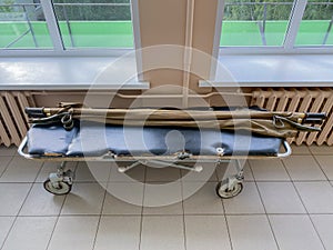 Medical trolley gurney with stretchers in hospital corridor
