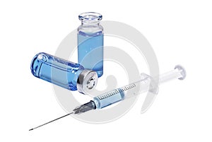 Medical vials with blue vaccine and syringe on white background