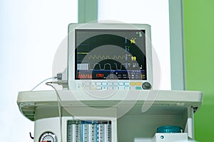 Medical vital signs monitor instrument in a hospital. This health care device displays and monitors heart rate and