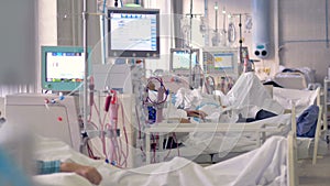 A medical ward with patients undergoing dialysis treatment.